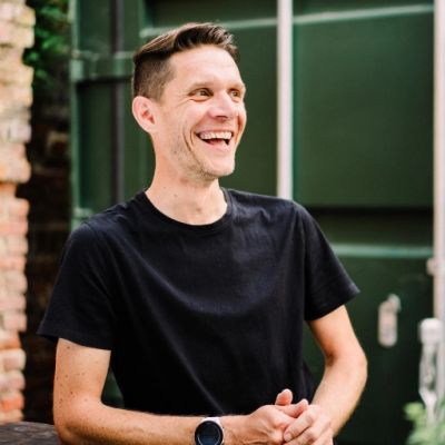 Photograph of Adam Chamberlin in the outside working space at The Mackman Group